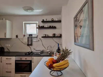 a bowl of fruit on a counter in a kitchen at Lavanda in Livno