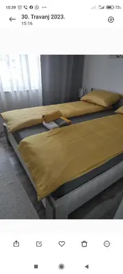 two beds sitting next to each other in a bedroom at Lavanda in Livno