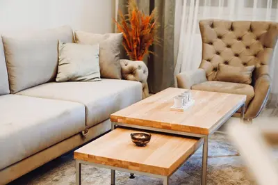a living room with a couch and a coffee table at Apartman Mosaic in Doboj