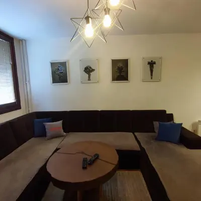 a living room with a couch and a table at Apartment Wolf in Novi Travnik