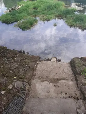 a puddle of water with the sky in it at Apartman Dalal - with access to river Una in Bihać
