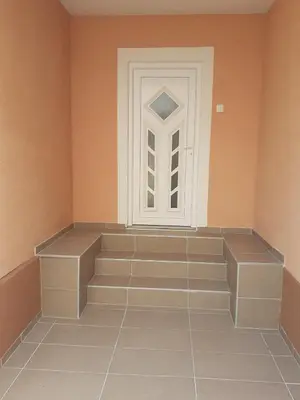 a room with a door and a tiled floor at Apartman Dalal - with access to river Una in Bihać