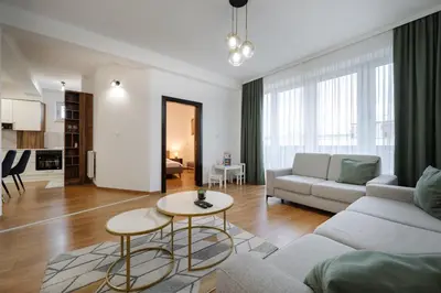 a living room with a couch and a table at Apartman Square Trg Prijedor in Prijedor