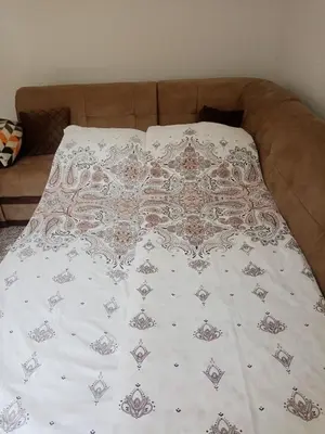 a bed with a blanket on top of it at Azra in Visoko
