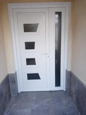 a white door with a window in a room at Azra in Visoko