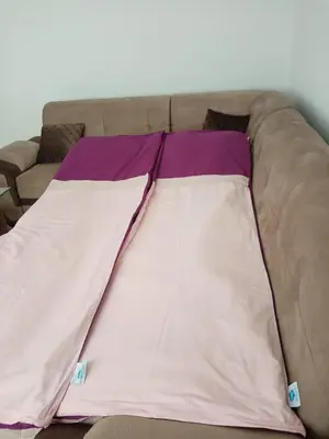 a blanket laying on top of a couch at Azra in Visoko