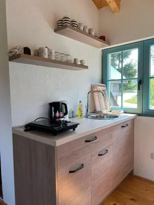 a kitchen with a sink and a counter top at Retro Village Ravne in Visoko