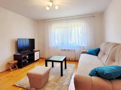 a living room with a couch and a tv at Kuća Mandić in Bosanska Gradiška