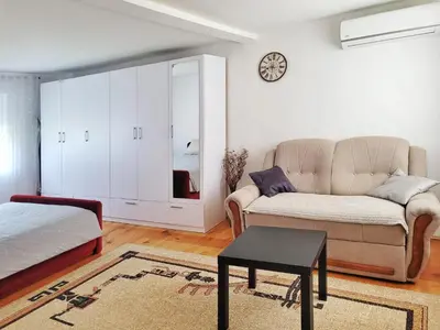 a living room with a couch and a table at Kuća Mandić in Bosanska Gradiška