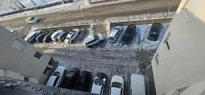 an aerial view of parked cars in a parking lot at Valley of Pyramids Residence in Visoko