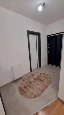 a room with a rug on the floor and a door at Valley of Pyramids Residence in Visoko