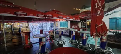 a row of bar stools in a bar at HomeB&E in Tuzla