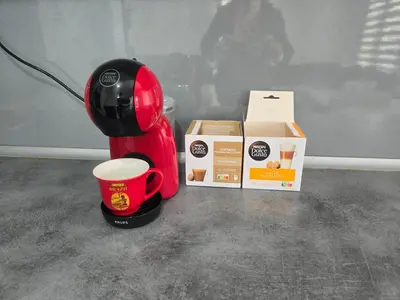 a coffee maker and a cup and boxes on a counter at Vikendica SUNCE in Banja Luka