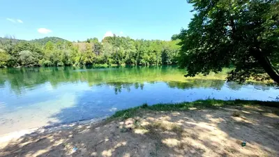 a view of a river with trees in the background at Stan na dan Novi Grad in Bosanski Novi