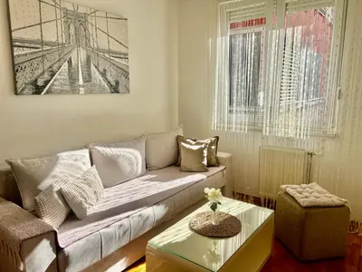 a living room with a couch and a table at Apartmani Casa in Banja Luka