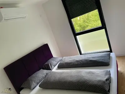 a bedroom with two beds and a window at Motel Platani Kotor Varoš in Kotorište
