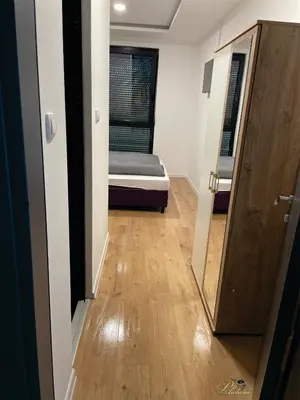 a small room with a bed and a mirror at Motel Platani Kotor Varoš in Kotorište