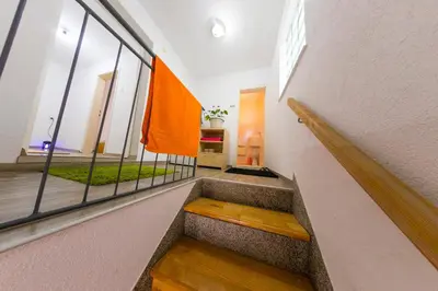 a staircase in a building with an orange flag on the wall at Apartman Bucko in Bihać