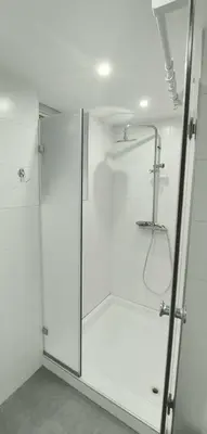 a shower with a glass door in a bathroom at Apartman Dona in Banja Luka