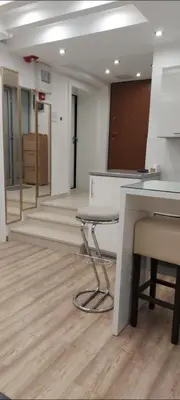 an empty room with a desk and chairs in an office at Apartman Dona in Banja Luka