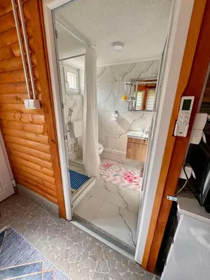 a glass door of a shower in a bathroom at Apartman Visoko-Oaza mira in Visoko