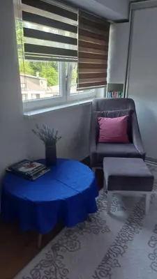 a living room with a couch and a table at Indy in Travnik