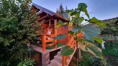 a tree house in a garden with a plant at Holiday Home SAJRA in Kulen Vakuf