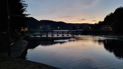 a body of water with a bridge in the background at Holiday Home SAJRA in Kulen Vakuf