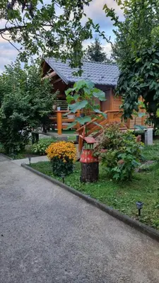 a house with a garden in front of it at Holiday Home SAJRA in Kulen Vakuf