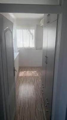 a room with a bathroom with a window and a door at Stan na dan Banovići in Banovići