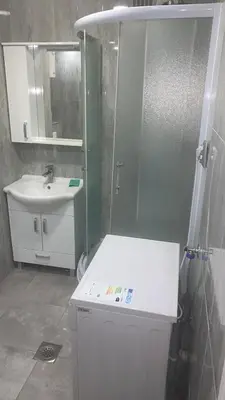 a bathroom with a shower and a sink and a toilet at Stan na dan Banovići in Banovići