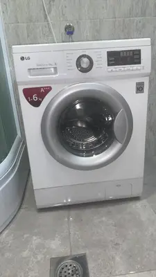 a washing machine is sitting on the floor at Stan na dan Banovići in Banovići