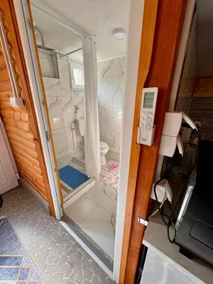 a small bathroom with a toilet inside of it at Oaza mira Visoko in Visoko