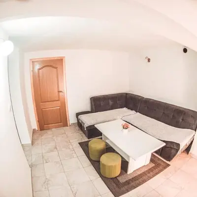 a living room with a couch and a table at 