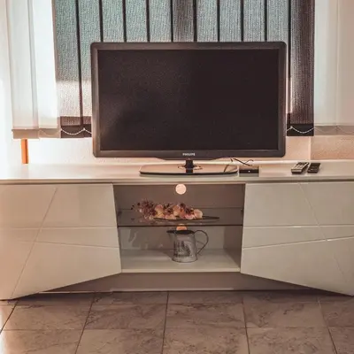 a television sitting on top of a desk at 