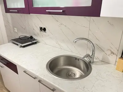 a kitchen counter with a sink in a kitchen at Una Bihac 4 in Bihać