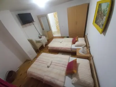 an overhead view of a room with three beds at Soba Dujaković in Banja Vrućica