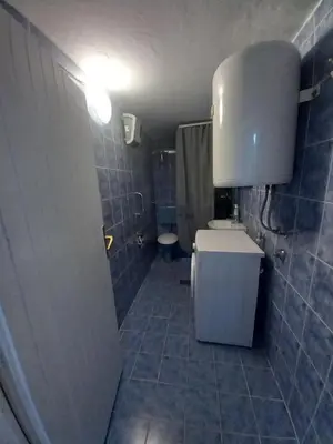 a small bathroom with a toilet and a sink at Soba Dujaković in Banja Vrućica