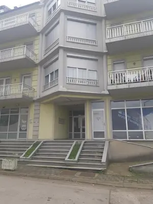 an apartment building with stairs in front of it at apartman Dani in Derventa