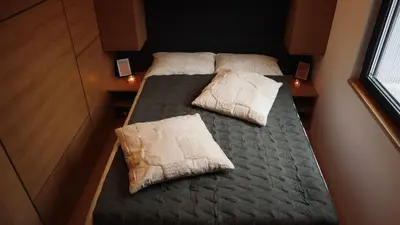 two beds in a small room with two pillows at Waterfall Glamping Cabin in Bihać