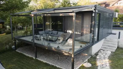 a gazebo with a couch in a yard at Waterfall Glamping Cabin in Bihać