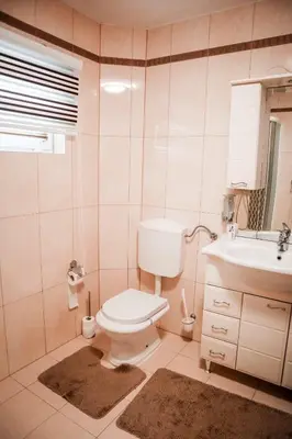 a bathroom with a toilet and a sink at Villa Sami in Bihać