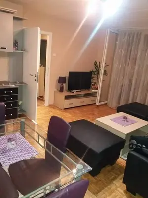 a living room with a couch and a tv at Apartman Radjenovic in Banja Luka
