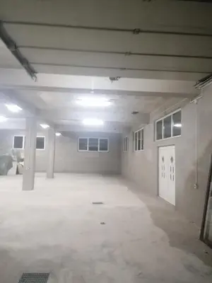 an empty room with a large white room with a door at Sphinx Apartment in Visoko