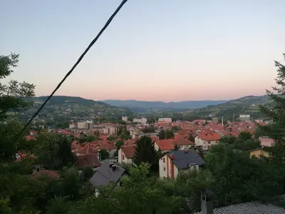 a view of a city from a zip line at Sphinx Apartment in Visoko
