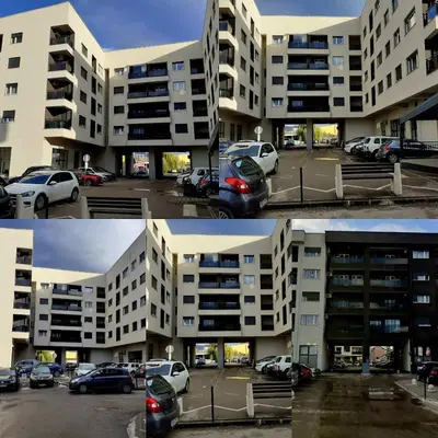 a group of buildings with cars parked in a parking lot at Apartman kod Brke 20 A Bulevar Vojvode Živojina Mišiča in Banja Luka