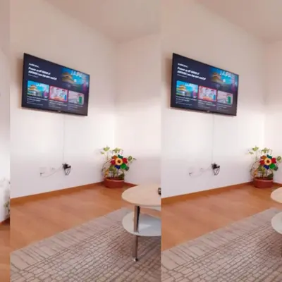 a room with a table and a tv on the wall at Apartman kod Brke 20 A Bulevar Vojvode Živojina Mišiča in Banja Luka