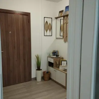 a hallway with a room with a door and a table at Little Paradise in Bihać