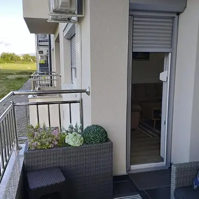 a balcony with plants on the side of a building at Little Paradise in Bihać