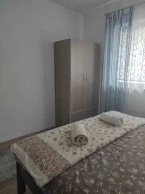 a bed with two pillows on it in a bedroom at Ajsha Guesthouse in Jajce